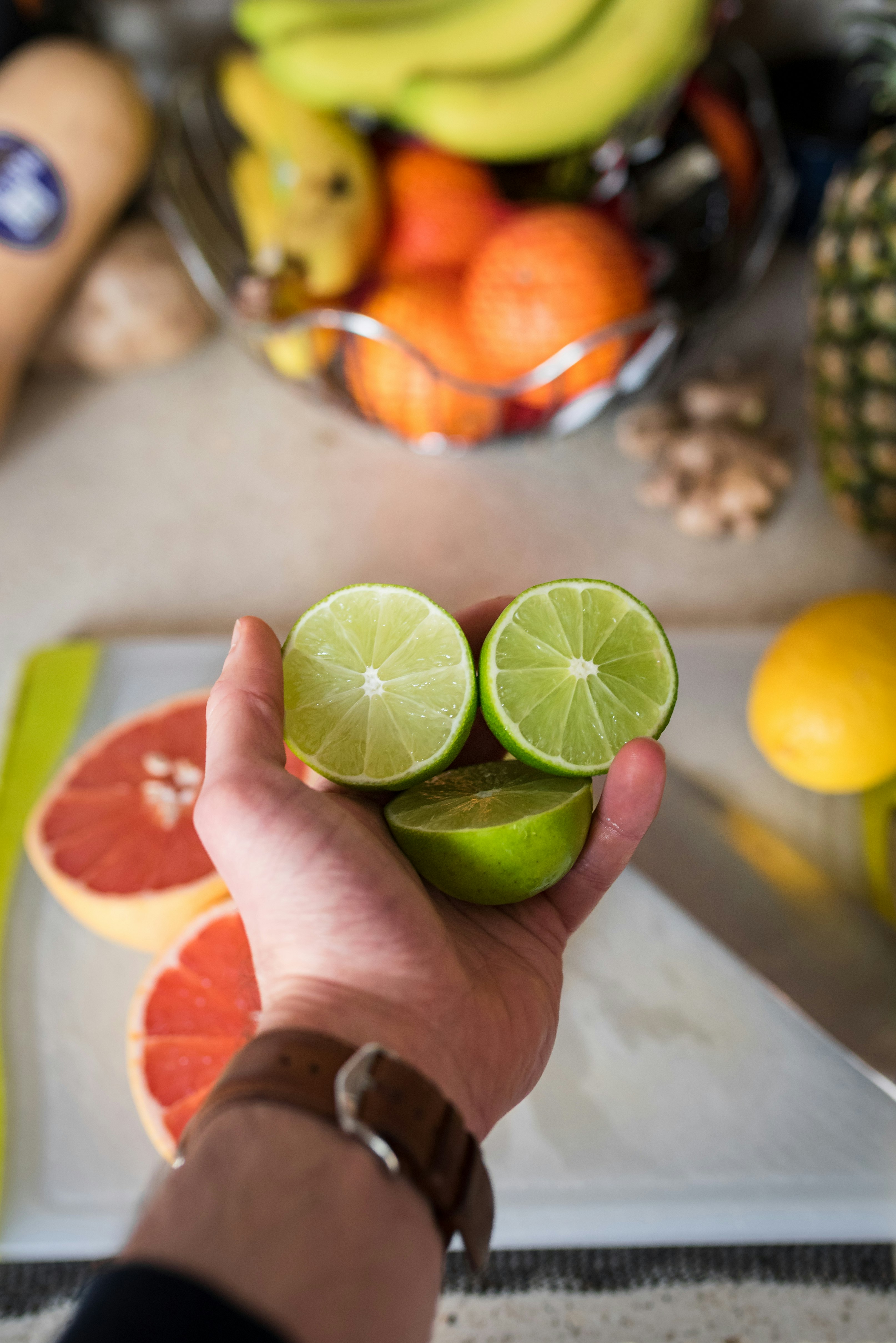 person holding sliced lemon fruit